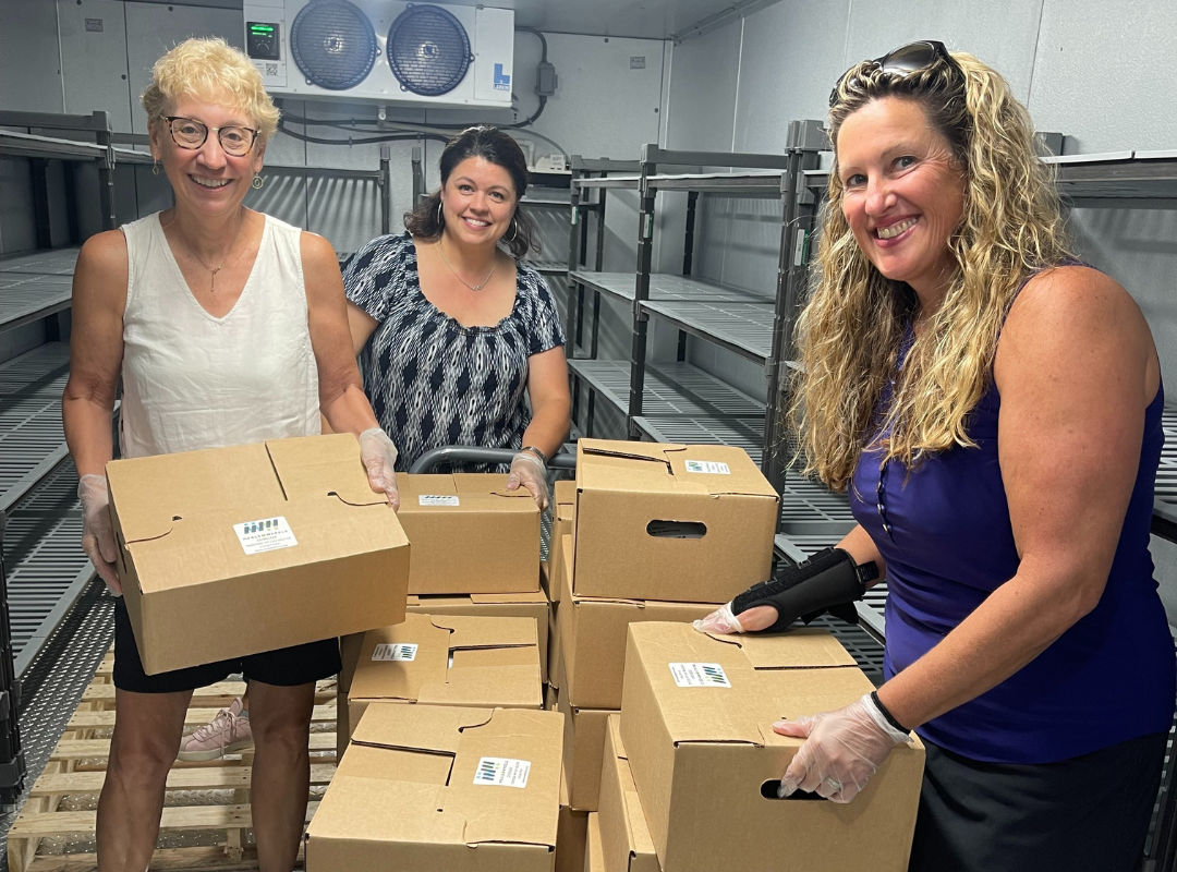 MOWD Board Members preparing produce boxes