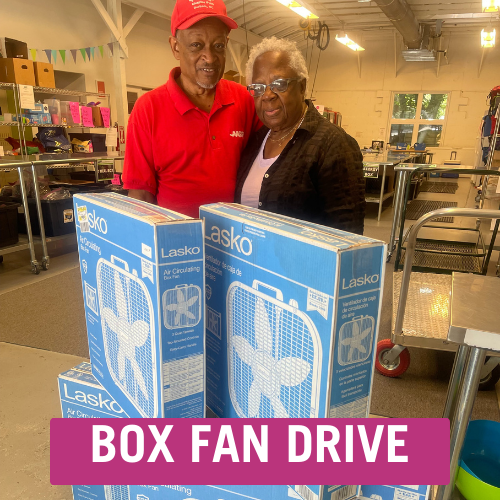 AARP members standing behind donated box fans