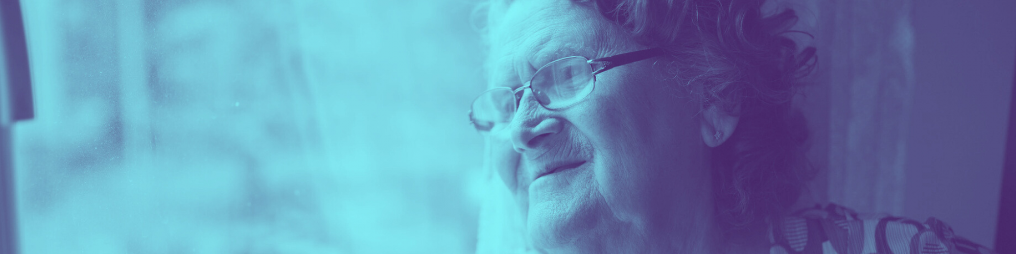 Older lady with glasses leaning against her window with a smize as she waits for her meal delivery.
